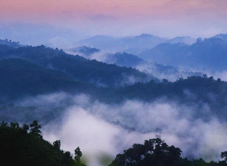 A scenic, mountainous view over Sajek Valley in Bangladesh Fog hangs over the mountains in Sajek Valley, Bangladesh